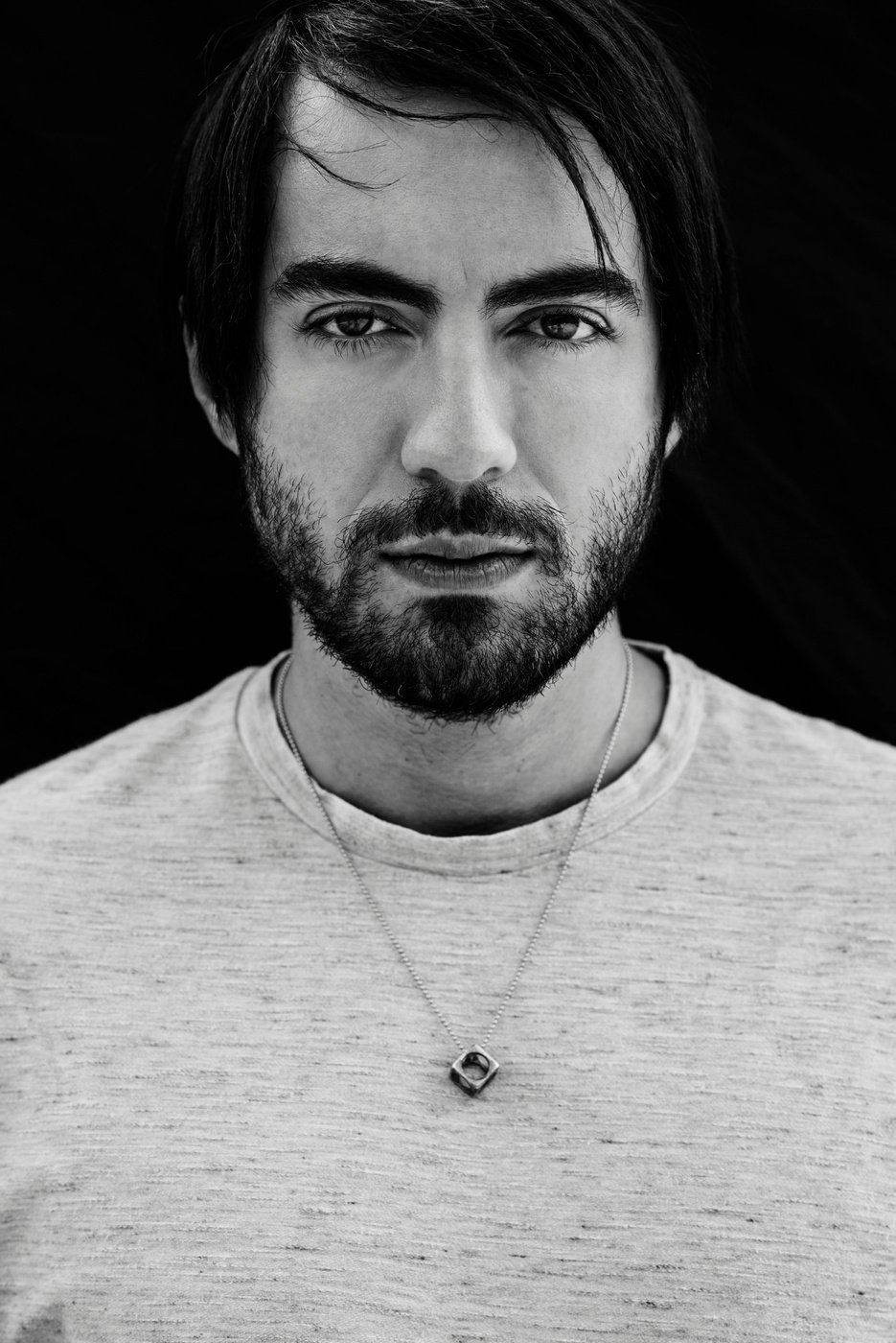 Grayscale Photo of Man Wearing Gray Crew-neck Shirt